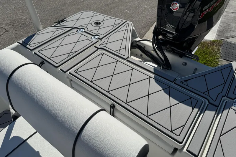 Slide: The Image of 2019 Cape Craft 180 boat deck with cushioned seating and Mercury engine. - 23