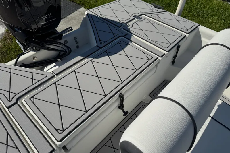 Slide: The Image of 2019 Cape Craft 180 boat interior with cushioned seating and storage compartments. - 25