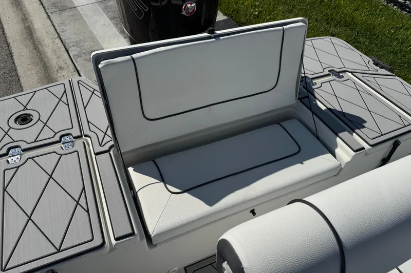 Slide: The Image of 2019 Cape Craft 180 boat with cushioned seating and storage compartments. - 26