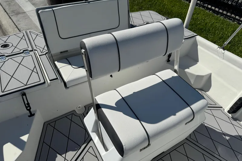 Slide: The Image of 2019 Cape Craft 180 boat interior with cushioned seating and modern design. - 27