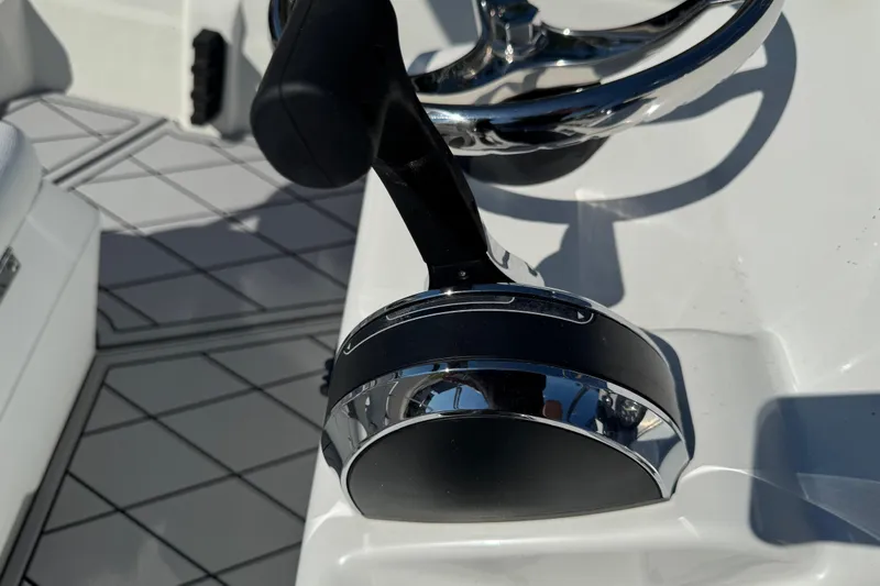 Slide: The Image of Close-up of 2019 Cape Craft 180 boat throttle and steering wheel. - 28