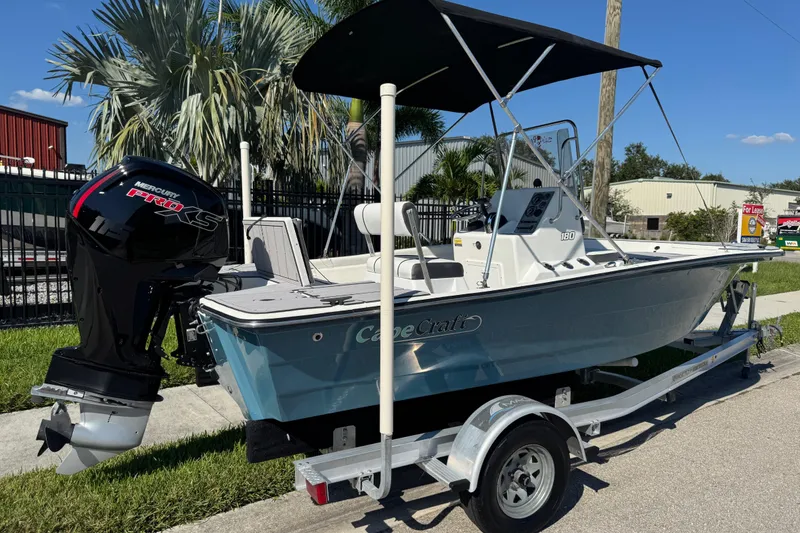 Slide: The Image of 2019 Cape Craft 180 boat with Mercury Pro XS engine on trailer, parked outdoors. - 31
