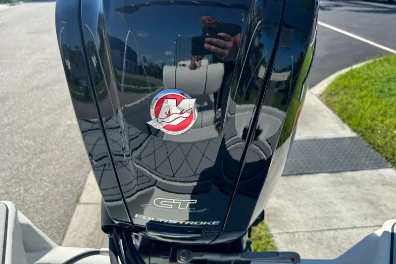 Slide: The Image of Close-up of a 2019 Cape Craft 180 boat's four-stroke engine with logo. - 5