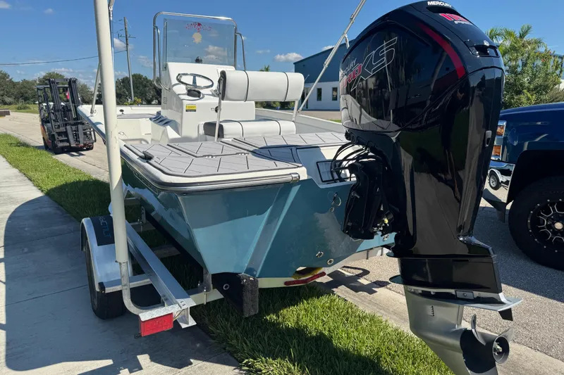 Slide: The Image of 2019 Cape Craft 180 boat with Mercury engine on trailer, parked outdoors. - 8