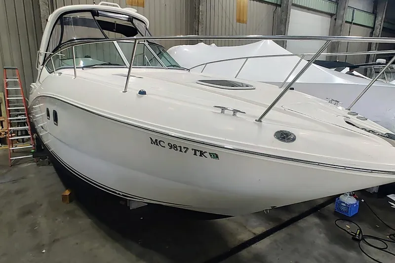 The Image of 2011 Sea Ray 330 Sundancer boat in indoor storage facility. - 0
