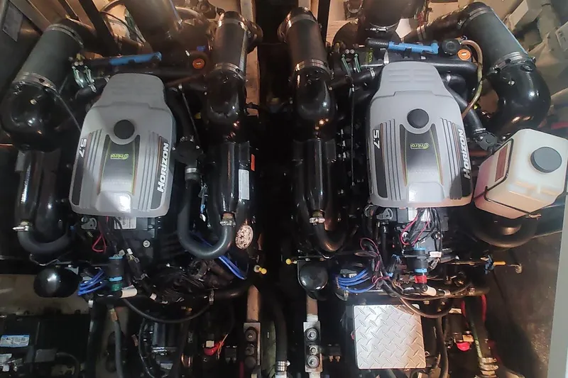 Slide: The Image of Twin engines of a 2011 Sea Ray 330 Sundancer boat, showcasing Horizon 5.7 motors. - 25