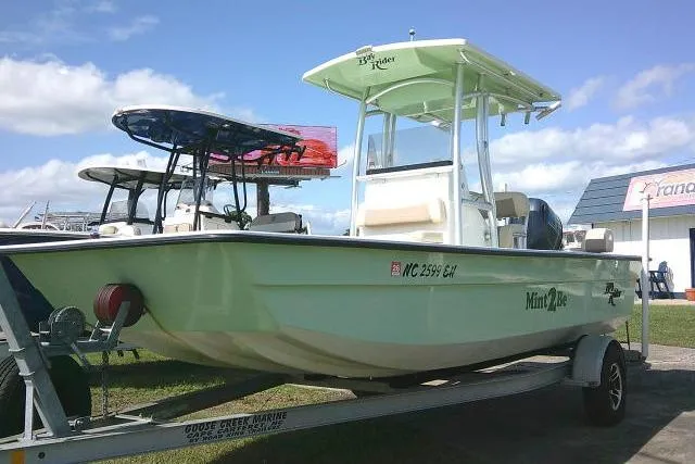 Slide: The Image of 2018 KenCraft 2060 BAYRIDER boat on trailer, parked outdoors under blue sky. - 1