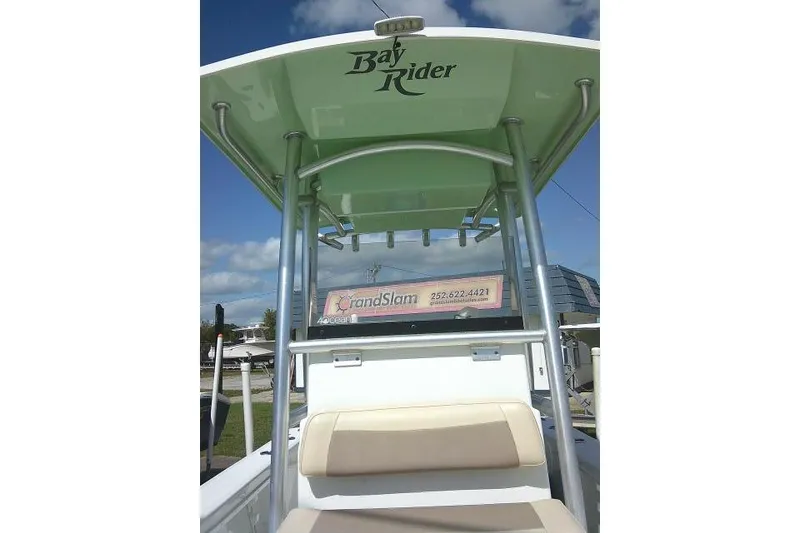 Slide: The Image of 2018 KenCraft 2060 BAYRIDER boat with T-top and seating, outdoors. - 12