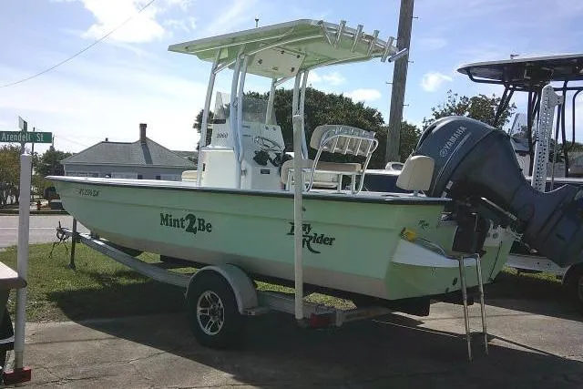 Slide: The Image of 2018 KenCraft 2060 BAYRIDER boat on trailer, parked outdoors, with Yamaha outboard motor. - 2