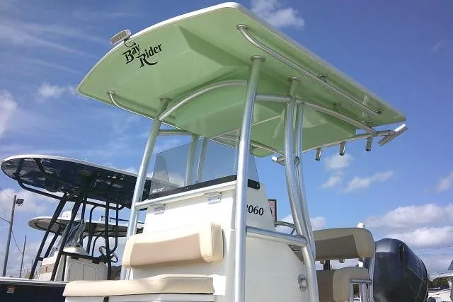 Slide: The Image of 2018 KenCraft 2060 BAYRIDER boat with T-top against blue sky background. - 6