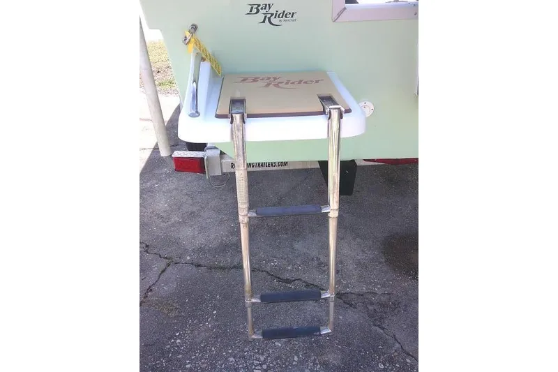 Slide: The Image of 2018 KenCraft 2060 BAYRIDER boat with foldable ladder on trailer. - 7