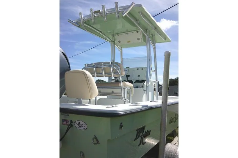 Slide: The Image of 2018 KenCraft 2060 BAYRIDER boat with T-top and seating, viewed from the rear. - 9