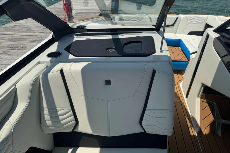 Slide: The Image of 2025 Nautique Super Air Nautique G23 interior with sleek seating and modern design. - 10