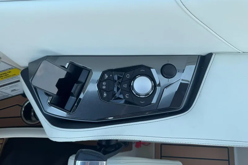 Slide: The Image of Control panel of 2025 Nautique Super Air Nautique G23 boat, featuring sleek design and modern controls. - 11