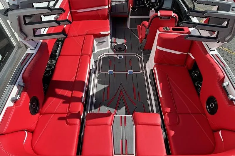 Slide: The Image of 2024 Supra SL 575 boat interior with vibrant red seating and modern design. - 13