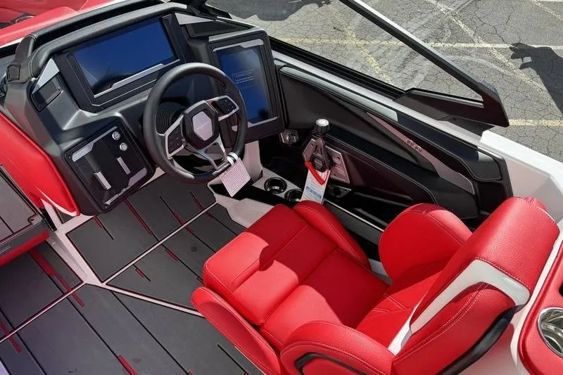 Slide: The Image of 2024 Supra SL 575 boat interior with red seats and modern dashboard. - 8