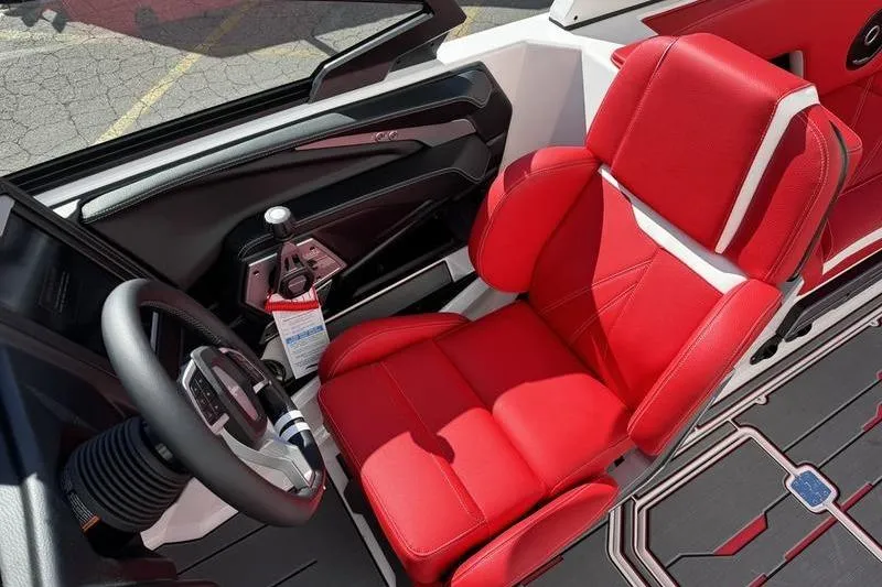 Slide: The Image of 2024 Supra SL 575 interior with red leather seat and modern steering wheel. - 9