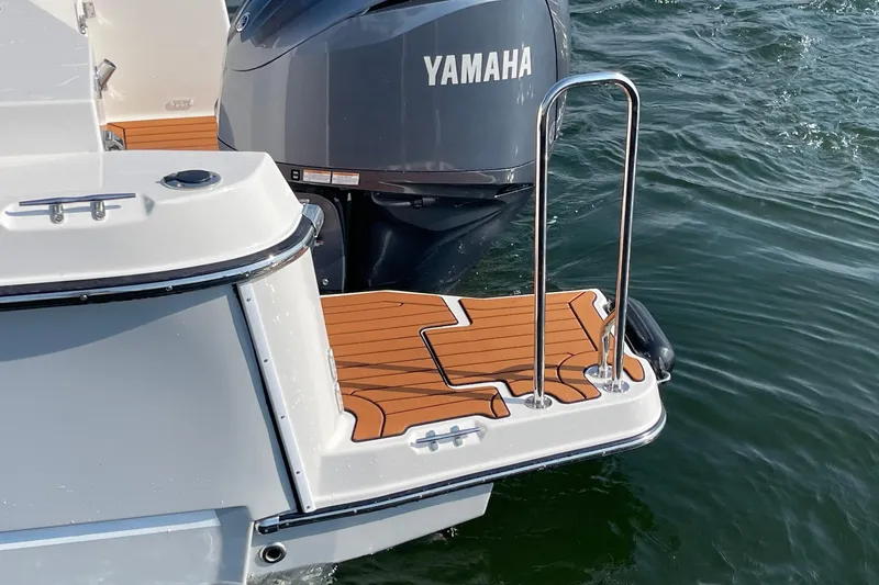 Slide: The Image of 2023 Ranger Tugs R-25 boat with Yamaha engine and swim platform. - 10