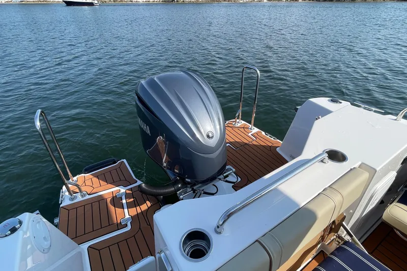 Slide: The Image of 2023 Ranger Tugs R-25 boat with Yamaha outboard motor on water. - 14