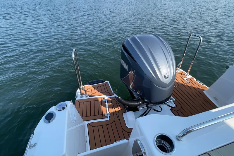 Slide: The Image of 2023 Ranger Tugs R-25 boat with Yamaha outboard motor on water. - 15