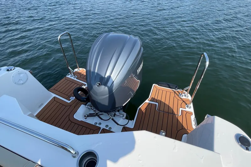 Slide: The Image of 2023 Ranger Tugs R-25 boat with Yamaha outboard motor on water. - 16