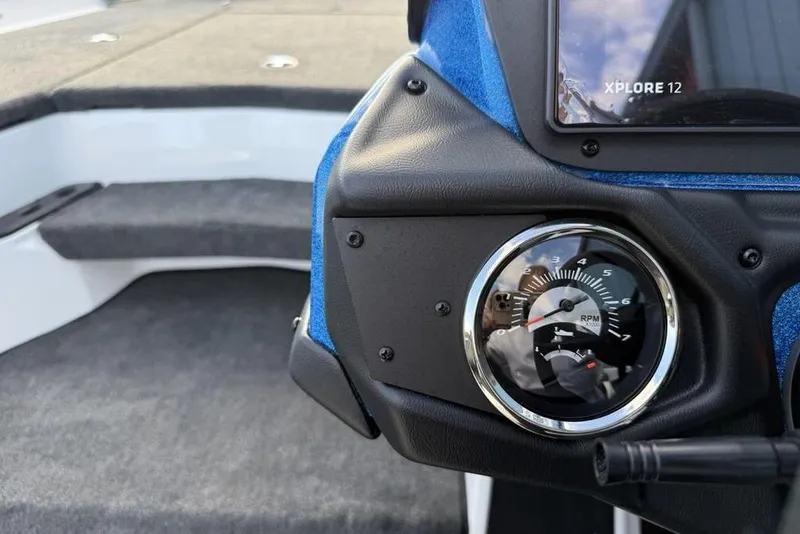 Slide: The Image of 2026 Skeeter ZXR19 SE boat dashboard with RPM gauge and Xplore 12 display. - 14