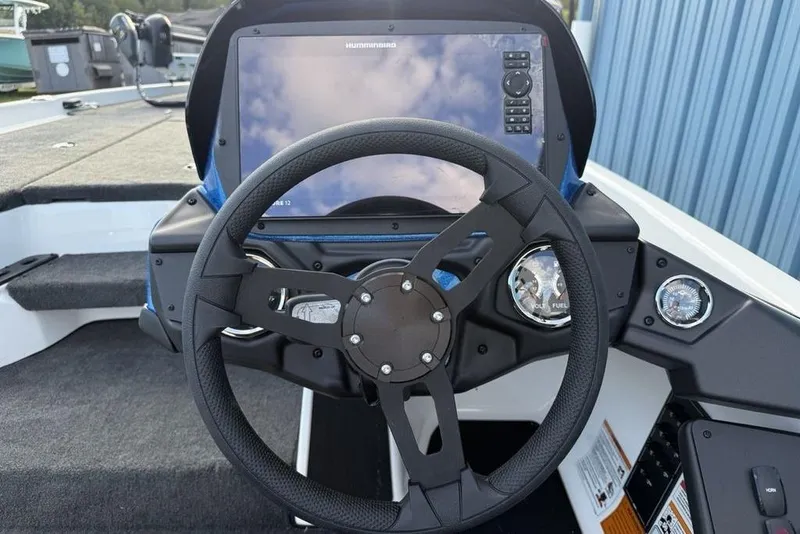 Slide: The Image of Steering wheel and dashboard of 2026 Skeeter ZXR19 SE boat with digital display. - 15