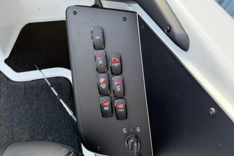 Slide: The Image of Control panel of 2026 Skeeter ZXR19 SE boat with labeled switches. - 18