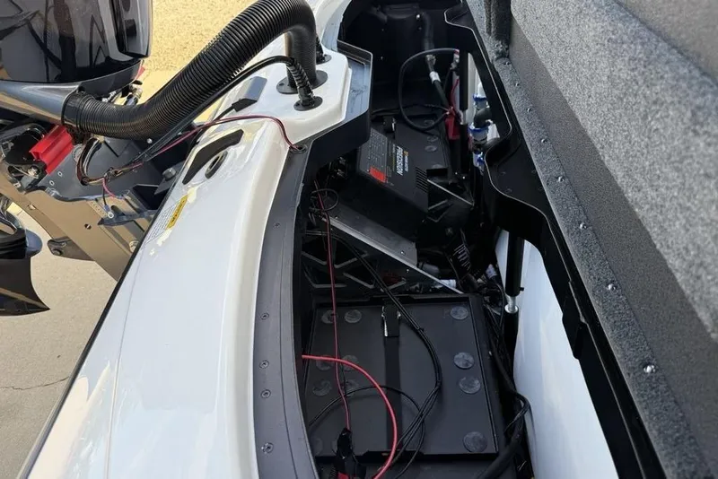 Slide: The Image of Interior view of a 2026 Skeeter ZXR19 SE boat, showcasing engine and wiring components. - 23