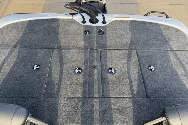 Slide: The Image of 2026 Skeeter ZXR19 SE boat deck with gray carpet and storage compartments. - 25