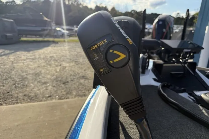 Slide: The Image of Close-up of a 2026 Skeeter ZXR19 SE boat control handle in sunlight. - 6