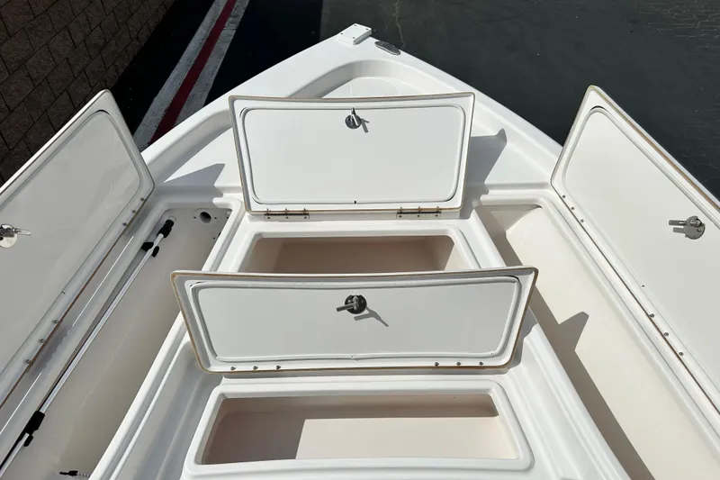 Slide: The Image of 2020 Blue Wave 2000 Classic boat interior with steering console and seating. - 11