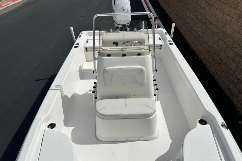 Slide: The Image of 2020 Blue Wave 2000 Classic boat deck with storage compartments and motor. - 12