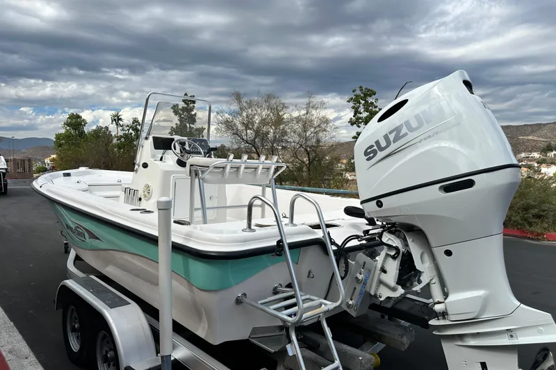 Slide: The Image of 2020 Blue Wave 2000 Classic boat with Suzuki outboard motor on a trailer. - 4