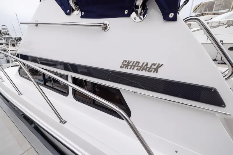 Slide: The Image of 2023 Skipjack 26 Flybridge boat with sleek design and stainless steel railings. - 10