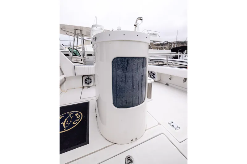 Slide: The Image of 2023 Skipjack 26 Flybridge boat deck with speakers and storage compartment. - 13