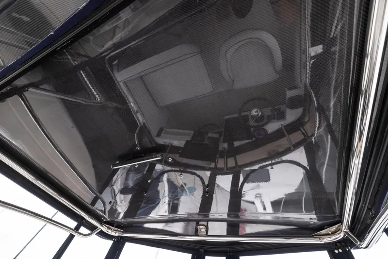 Slide: The Image of 2023 Skipjack 26 Flybridge interior view with modern helm and seating. - 15