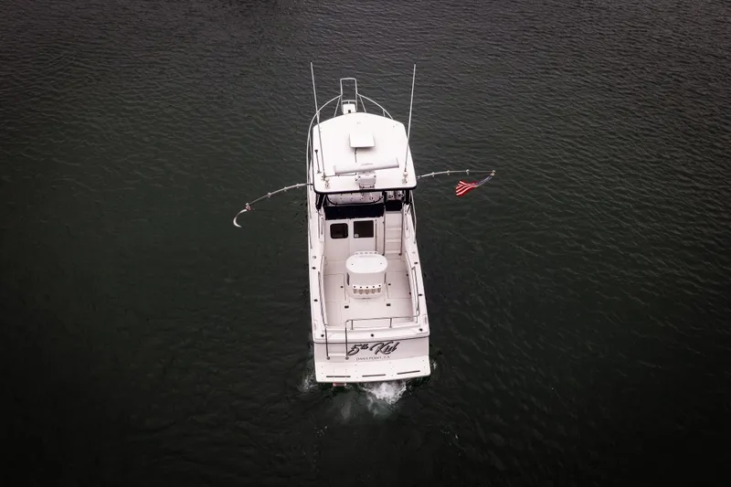Slide: The Image of Aerial view of 2023 Skipjack 26 Flybridge boat on water. - 6