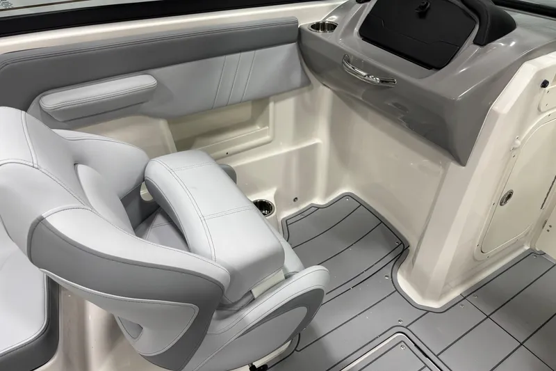 Slide: The Image of 2026 Chaparral 23 SSi boat interior with gray seating and sleek dashboard design. - 18