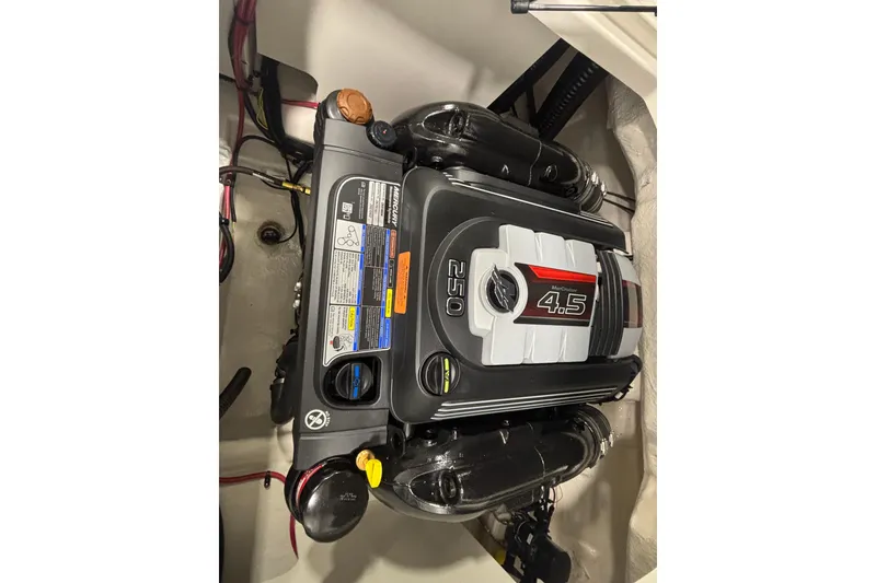 Slide: The Image of 2026 Chaparral 23 SSi boat engine, MerCruiser 4.5L, 250 horsepower, detailed view. - 23