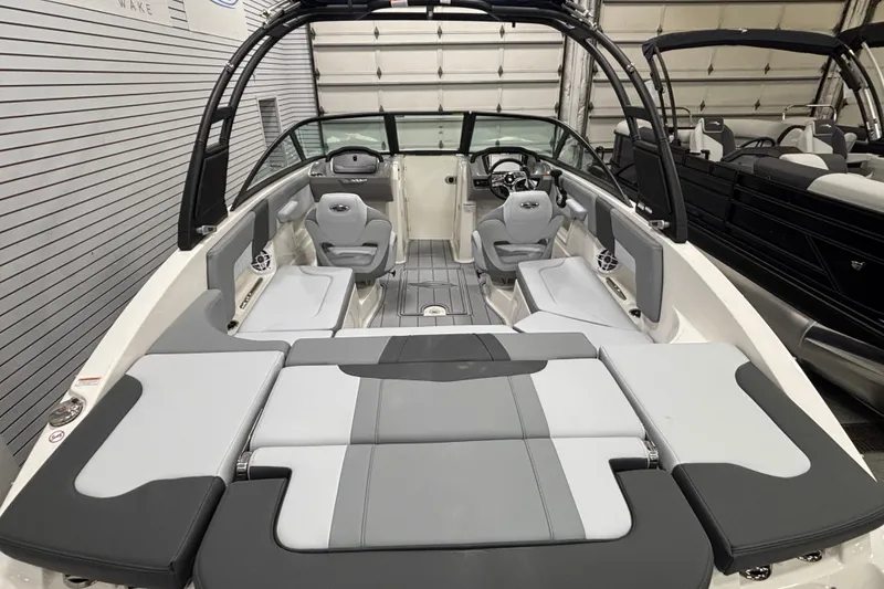 Slide: The Image of 2026 Chaparral 23 SSi boat interior with gray seating and modern design. - 26
