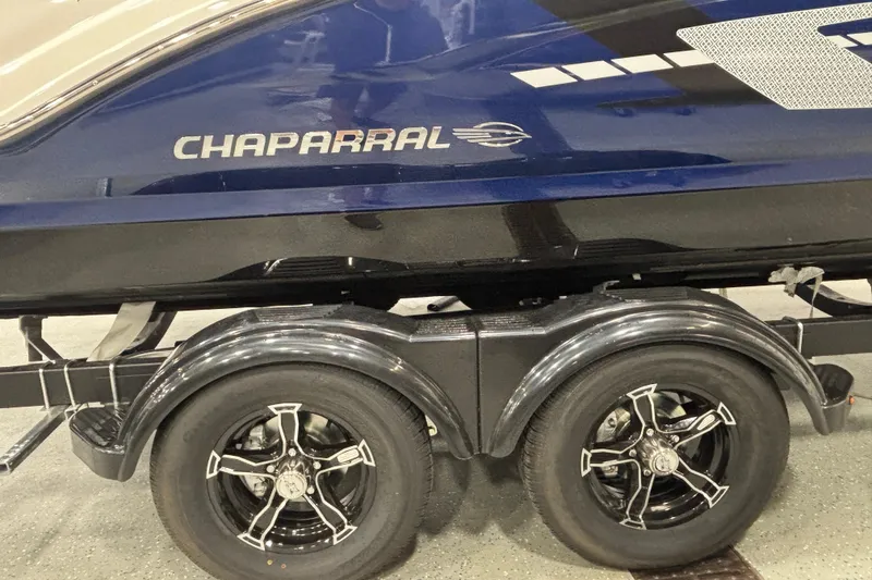 Slide: The Image of 2026 Chaparral 23 SSi boat on trailer, featuring sleek design and stylish wheels. - 6