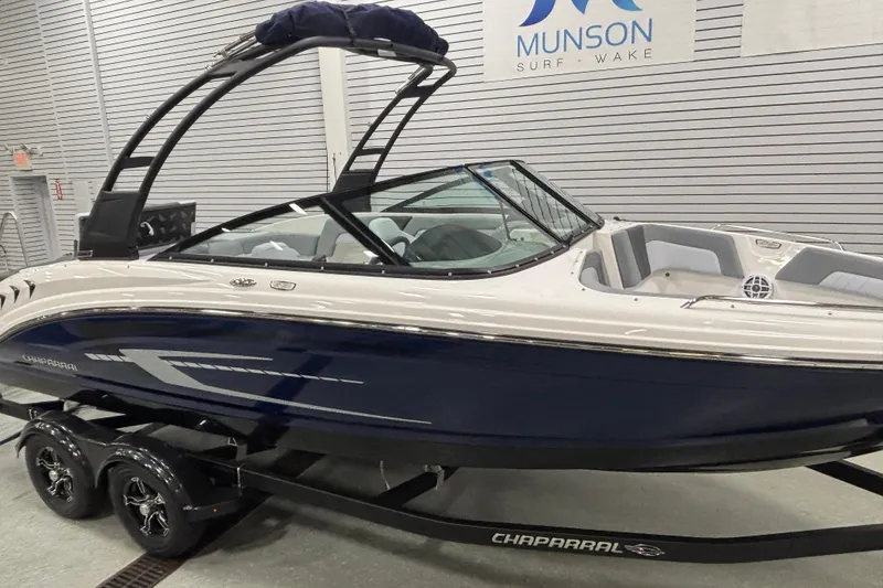 Slide: The Image of 2026 Chaparral 23 SSi boat on trailer at Munson Surf & Wake showroom. - 7