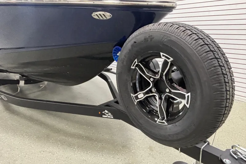 Slide: The Image of 2026 Chaparral 23 SSi boat on trailer, featuring sleek design and modern wheel. - 9