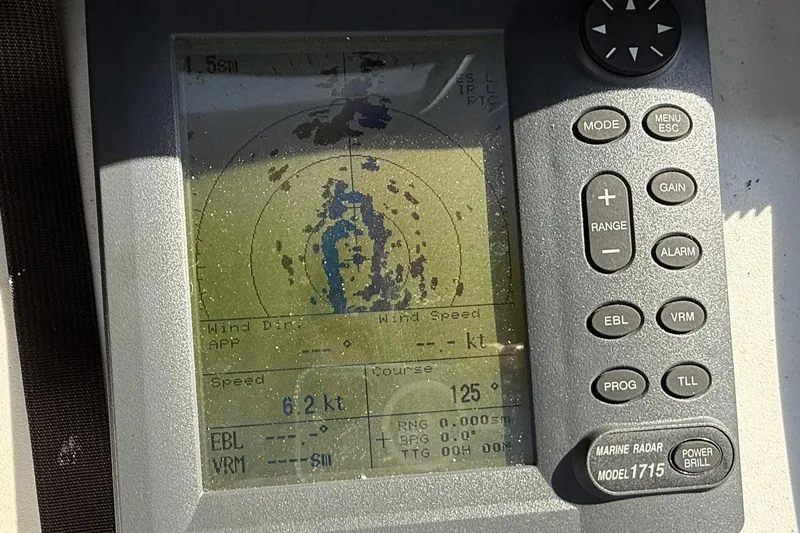 Slide: The Image of Marine radar display on 1983 Wilbur 34 Fly Bridge Cruiser, showing speed and course. - 33