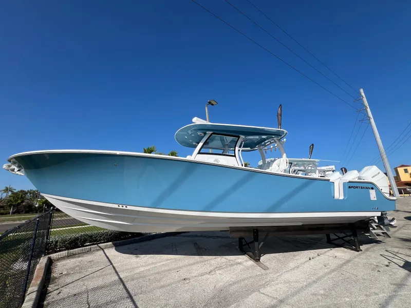 Slide: The Image of 2025 Sportsman 352 Open boat displayed outdoors under clear blue sky. - 0