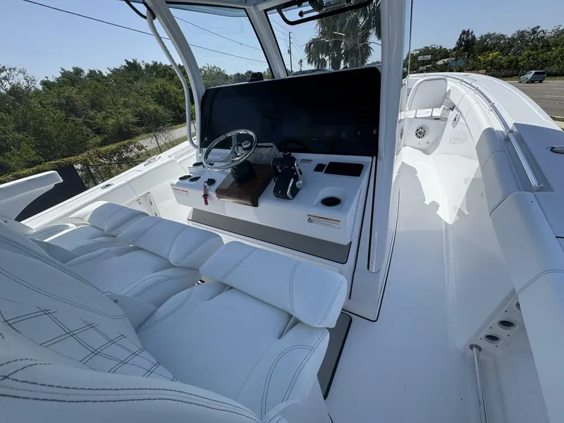 Slide: The Image of 2025 Sportsman 352 Open boat interior with sleek white seating and modern helm controls. - 14