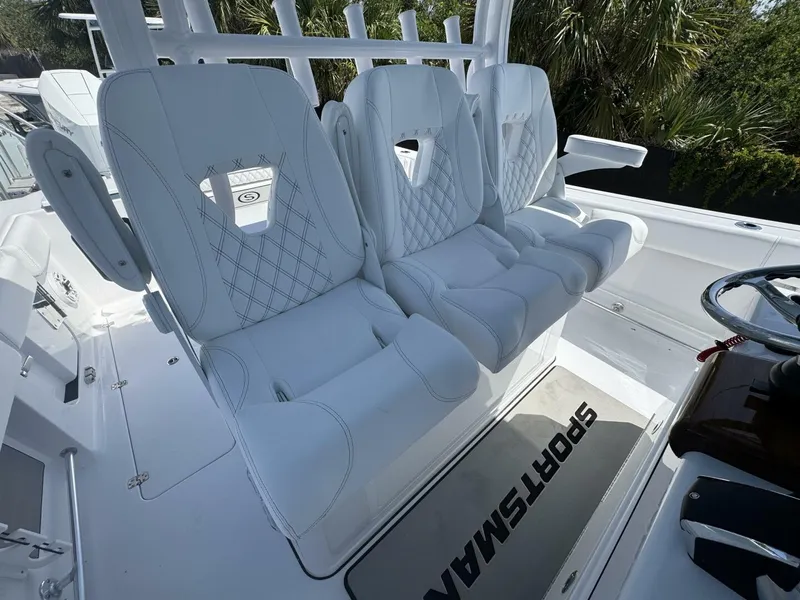 Slide: The Image of Luxury seating on 2025 Sportsman 352 Open boat, featuring white cushioned seats and sleek design. - 15