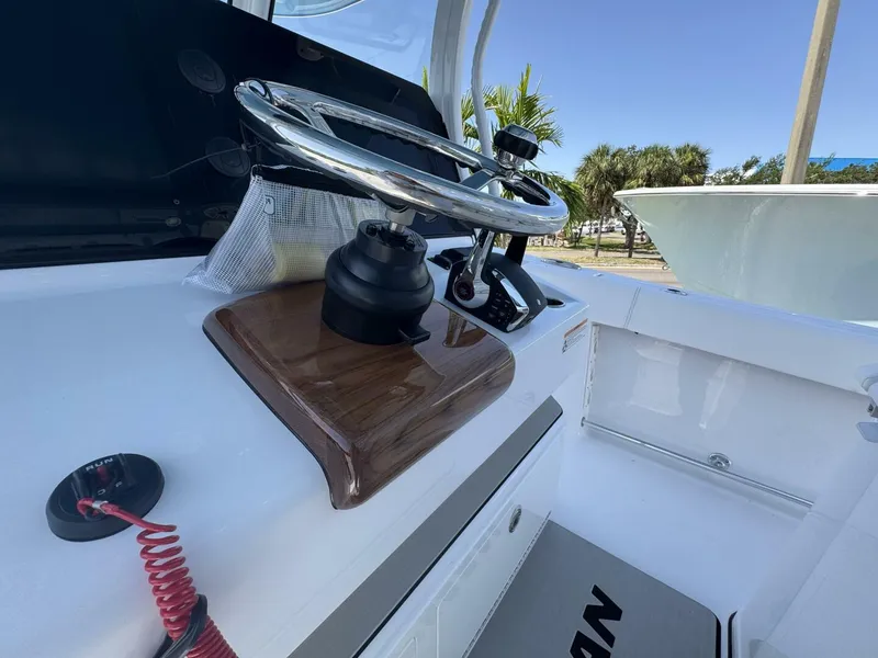 Slide: The Image of Steering wheel of 2025 Sportsman 352 Open boat, showcasing modern design and controls. - 17