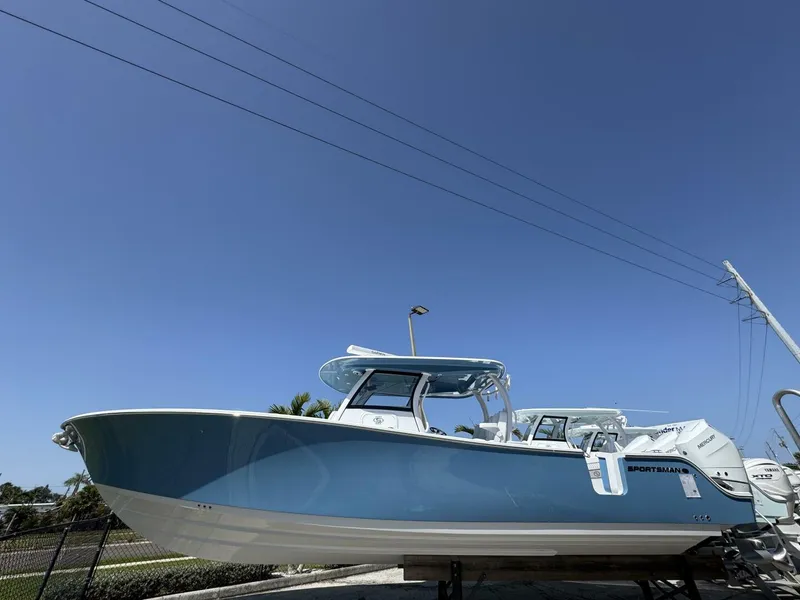 Slide: The Image of 2025 Sportsman 352 Open boat displayed outdoors under clear blue sky. - 3